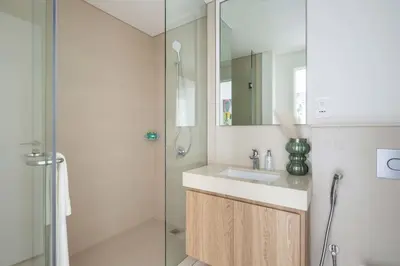 a bathroom with a sink and a shower at Frank Porter - Downtown Views II Tower 1 in Dubai