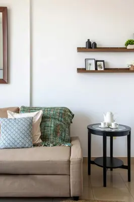 a living room with a couch and a table at Frank Porter - Golf Tower 3 in Dubai