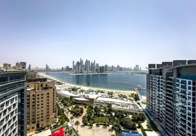 a view of the city of dubai from a skyscraper at Goldbest - Seven Palm 4ppl in Dubai