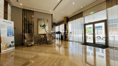 a lobby of a building with chairs and a window at Modern loft Studio in Damac Majestine,Business Bay in Dubai