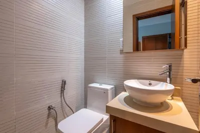 a bathroom with a white sink and a toilet at GuestReady - Stunning hideaway in Dubai Marina in Dubai