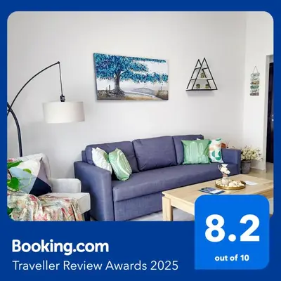 a living room with a blue couch and a table at Stunning 1 Bedroom Apartment in Dubai Marina in Dubai