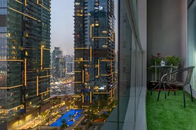 a view of a city at night from a skyscraper at Stunning 1 Bedroom Apartment in Dubai Marina in Dubai