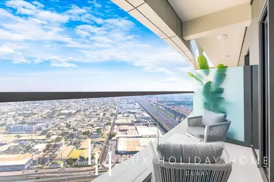 a room with a view of a city at LUX The Aykon Suite in Dubai