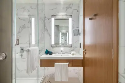 a bathroom with a sink and a shower at Dream Inn - Address Dubai Opera Residences in Dubai