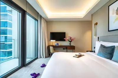 a hotel room with a bed and a large window at Dream Inn - Address Dubai Opera Residences in Dubai