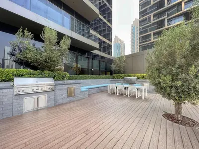 a courtyard with tables and chairs in a building at Dream Inn - Address Dubai Opera Residences in Dubai