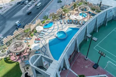 an overhead view of a pool at a resort at Cozy Studio Apartment in DIFC in Dubai