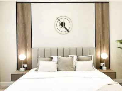 a bedroom with a large bed with white sheets and pillows at Elegantly Renovated 1BR Apartment at 5 Star Resort in Dubai