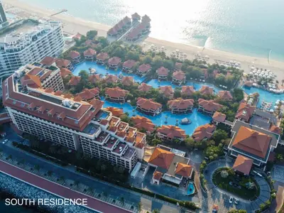 an aerial view of a resort near the beach at Elegantly Renovated 1BR Apartment at 5 Star Resort in Dubai