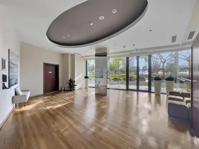 a large living room with a large ceiling at Iconic Burj View 1BR in Burj Vista Tower Near Shops & Metro in Dubai