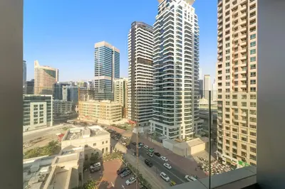 a view of a city with tall buildings at FIRST CLASS Studio Luxe Serenity Retreat in Dubai