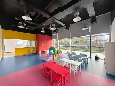 a dining room with red tables and chairs and a large window at FIRST CLASS 1BR Luxury Living in DIFC in Dubai