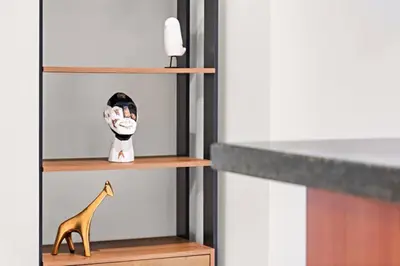 a book shelf with a giraffe and a toy at FIRST CLASS 1BR Luxury Living in DIFC in Dubai