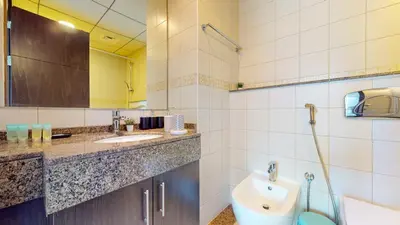 a bathroom with a sink and a toilet at Bay Central 2 - Charming One Bedroom in Dubai