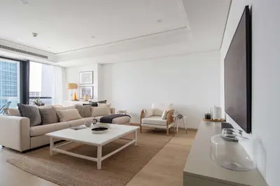 a living room with a couch and a table at Frank Porter - Goldcrest Views 2 in Dubai