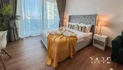 Gallery image of Rare Holiday Homes - Lake View - The Lago Vista Tower A - Dubai Production City - R1503 in Dubai