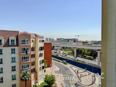 a view of a city with buildings and a highway at Rare Holiday Homes - Mediterranean Cluster - Near Ibn Battuta Mall - Discovery Garden - Building# Med 49 - R505 in Dubai