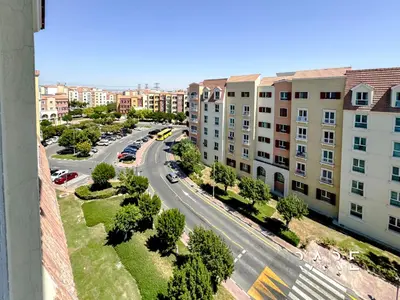 an aerial view of a city street with buildings at Rare Holiday Homes - Mediterranean Cluster - Near Ibn Battuta Mall - Discovery Garden - Building# Med 49 - R505 in Dubai