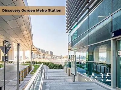 a view of a modern office building with a street at Rare Holiday Homes - Mediterranean Cluster - Near Metro - Discovery Garden - Building# Med 103 - RG07 in Dubai