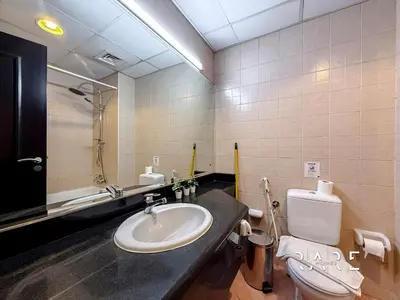 a bathroom with a sink and a toilet at Rare Holiday Homes - Mediterranean Cluster - Near Metro - Discovery Garden - Building# Med 103 - RG07 in Dubai