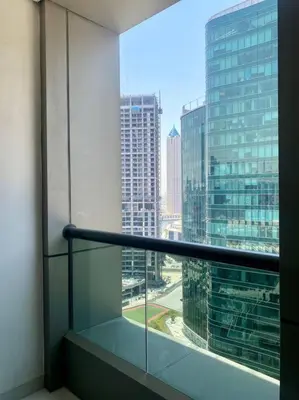 a view of a city from a window in a building at Downtown Studio - Cour Jardin in Dubai