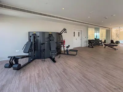 a gym with treadmills and machines in a room at Waterfront Living 2BR Apartment in Marina Star, Dubai Marina by Deluxe Holiday Homes in Dubai