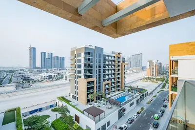 an overhead view of a city with tall buildings at Luxurious 2BR Apartment in Azizi Riviera 18, Al Merkadh by Deluxe Holiday Homes in Dubai