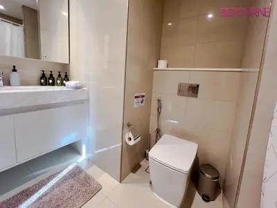 a bathroom with a toilet and a sink at 2BR Stunning Full Burj Khalifa View in Dubai