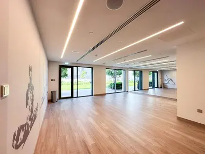 an empty room with wood floors and glass doors at Breathtaking Burj View, Sky High Luxury 2BR Apartment by 2nd Best Home in Dubai