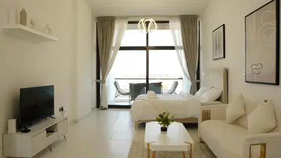 a living room with a bed and a couch and a tv at Dimorelux l Club Vista Mare l Five Palm Jumeirah in Dubai