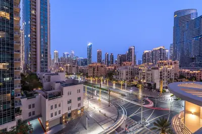 a view of a city at night with buildings at Boulevard 2 BR- Burj Khalifa-Dubai Mall- pool-Gym in Dubai