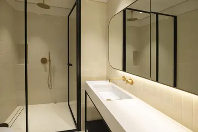 a bathroom with a sink and a shower at Modern Studio at Upside Living, Business Bay with Burj Khalifa View in Dubai