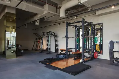 a gym with lots of equipment in a room at Modern Studio at Upside Living, Business Bay with Burj Khalifa View in Dubai