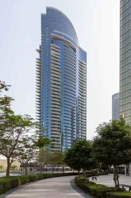 a tall building with a road in front of it at Silkhaus Modern 1BDR near Almas in East Lake in Dubai