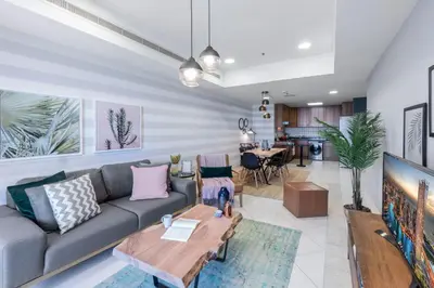 a living room with a couch and a table at Blueground Marina Pool Gym DXB-237 in Dubai