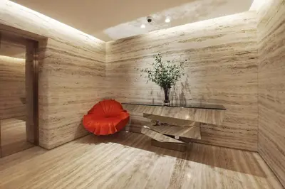 a room with a bench and a vase of flowers at Blueground Duja Tower City View pool gym DXB-1108 in Dubai