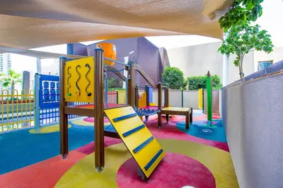 a childrens playground with a slide and a slideintend at Blueground Marina Gate city view sauna gym DXB-1338 in Dubai