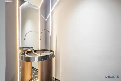 a bathroom with a toilet in the corner of a room at Picturesque 3BR with Assistant Room in The One JBR by Deluxe Holiday Homes in Dubai