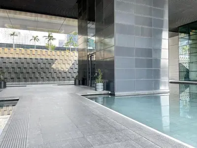 a building with a pool in the middle of it at Blueground DIFC indoor pool fitness center DXB-1515 in Dubai