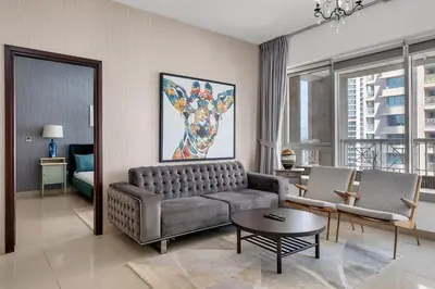 a living room with a couch and a table at Bellavista 1 Bedroom Full Burj Khalifa View 29 Boulevard Downtown Dubai in Dubai