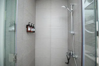 a shower in a bathroom with a glass door at Canal Vista - Home near Downtown - Awsesome views in Dubai
