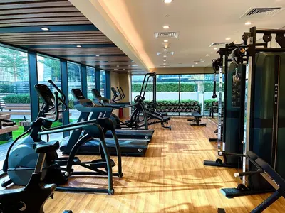 a gym with treadmills and exercise equipment in a building at Canal Vista - Home near Downtown - Awsesome views in Dubai