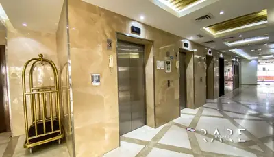 a hallway with a elevator in a building at Rare Holiday Homes - Jumeirah Village Circle - Near Circle Mall - Botanica Tower - R105 in Dubai