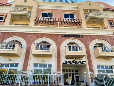 a building with balconies on the side of it at Rare Holiday Homes - Near Circle Mall - Lavender 1 - R309 - Jumeirah Village Circle in Dubai