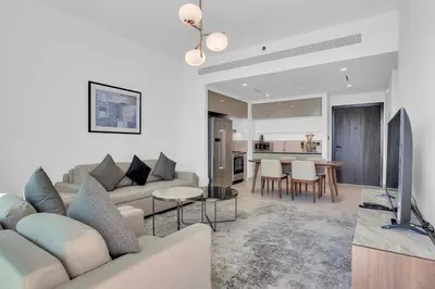 a living room with a couch and a table at Dubai Marina Harbour View 2BR with Beach Access in Dubai