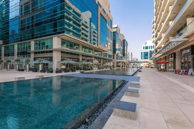 a swimming pool in the middle of a building at Stylish Apartment Huge Terrace Near Burj Khalifa in Dubai