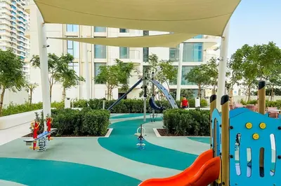 a playground in a building with a roller coaster at Stunning Palm View 1BR Apartment in Dubai Harbour in Dubai