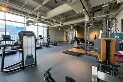 a gym with a lot of equipment in a room at Stylish Studio in Upside Living with Top Amenities in Dubai