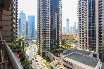an aerial view of a city with tall buildings at Spacious 1BR - Elite Downtown Residence - Short Walk to Burj & Dubai Mall in Dubai
